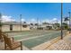 Outdoor shuffleboard courts in a community setting, complemented by benches and exterior lighting at 2601 Gulf N Dr # B24, Bradenton Beach, FL 34217