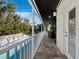 Expansive balcony with seating overlooking a pool and water feature, perfect for relaxation and outdoor living at 3322 Bayou Rd, Longboat Key, FL 34228
