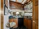 Sophisticated home bar with custom cabinetry, a sink, and wine storage at 3322 Bayou Rd, Longboat Key, FL 34228