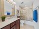 Well-lit bathroom featuring a vanity, mirror, and a tiled shower with glass doors at 3322 Bayou Rd, Longboat Key, FL 34228