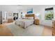 Bright bedroom featuring hardwood floors, natural light, and a comfortable bed at 3322 Bayou Rd, Longboat Key, FL 34228