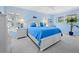 Charming blue bedroom features bright, natural light, stylish decor, and a comfortable bed at 3322 Bayou Rd, Longboat Key, FL 34228