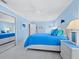 Bright, airy blue bedroom with white trim, natural light, and ample storage space at 3322 Bayou Rd, Longboat Key, FL 34228