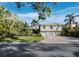 Charming two-story home with a manicured lawn and a spacious three-car garage at 3322 Bayou Rd, Longboat Key, FL 34228