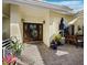 Charming front porch featuring a decorative front door and a comfortable seating area at 3322 Bayou Rd, Longboat Key, FL 34228