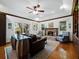 Bright living room with a fireplace, wood floors, and access to the outdoors at 3322 Bayou Rd, Longboat Key, FL 34228