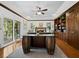 Spacious living room features a fireplace, custom built-ins, and unique desk area at 3322 Bayou Rd, Longboat Key, FL 34228