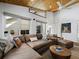 Comfortable living room with a leather sectional sofa, patterned pillows, and stylish decor at 3322 Bayou Rd, Longboat Key, FL 34228