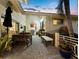 Outdoor patio features brick pavers, outdoor seating, grill, and views of the home's exterior at 3322 Bayou Rd, Longboat Key, FL 34228