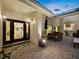 Outdoor patio features brick pavers, outdoor seating, grill, and views of the home's interior at 3322 Bayou Rd, Longboat Key, FL 34228