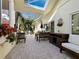 Relaxing outdoor seating area featuring a dining table and lush landscaping at 3322 Bayou Rd, Longboat Key, FL 34228
