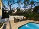 Relaxing patio area with comfortable seating and lush landscaping at 3322 Bayou Rd, Longboat Key, FL 34228