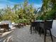 Charming outdoor area with a wet bar, perfect for entertaining next to the sparkling pool and lush landscaping at 3322 Bayou Rd, Longboat Key, FL 34228