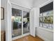 Bright room with white shutters showcasing the patio and natural outdoor light at 3322 Bayou Rd, Longboat Key, FL 34228