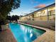Sparkling swimming pool offers a refreshing escape, complimented by a covered patio with views of the yard at 3322 Bayou Rd, Longboat Key, FL 34228