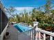 Inviting pool area featuring lush landscaping and serene water features, perfect for outdoor relaxation and entertainment at 3322 Bayou Rd, Longboat Key, FL 34228