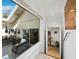 Interior view overlooking a private patio with outdoor seating and a partial kitchen view at 3322 Bayou Rd, Longboat Key, FL 34228