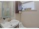 Bathroom featuring a vanity sink with a mirror, a toilet, a cabinet and a window at 3526 Austin St, Sarasota, FL 34231
