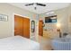 Bedroom featuring a ceiling fan, a closet, a television, and a chest of drawers at 3526 Austin St, Sarasota, FL 34231