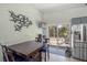 Dining Area adjacent to kitchen offers seating for four and stainless refrigerator is easily accessible at 3526 Austin St, Sarasota, FL 34231