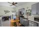 Spacious kitchen with gray cabinets, butcher block island, and stainless-steel appliances at 3526 Austin St, Sarasota, FL 34231