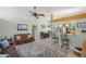 Cozy living room featuring warm natural lighting, a plush rug, and views into the kitchen at 3526 Austin St, Sarasota, FL 34231