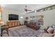 Comfortable living room with light walls, a decorative rug, and bright lighting from multiple windows at 3526 Austin St, Sarasota, FL 34231