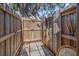 Private outdoor shower with wood fencing offering a refreshing space surrounded by nature at 3526 Austin St, Sarasota, FL 34231
