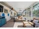 Inviting screened porch featuring comfortable seating, ceiling fans, and serene backyard views at 3526 Austin St, Sarasota, FL 34231