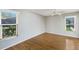 Bright bedroom with laminate flooring, neutral walls, ceiling fan and views of the outdoor greenery at 3606 Garden Lakes Clenet, Bradenton, FL 34203