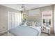 Cozy bedroom with natural light, ceiling fan, and ample closet space at 3606 Garden Lakes Clenet, Bradenton, FL 34203