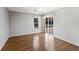 Bright bedroom features hardwood floors, large window and access to the screened-in lanai with pool at 3606 Garden Lakes Clenet, Bradenton, FL 34203