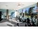 Bright exercise room with gym equipment and large windows offering outdoor views at 3606 Garden Lakes Clenet, Bradenton, FL 34203
