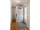 Inviting foyer with beautiful flooring, a white front door, and access to other rooms at 3606 Garden Lakes Clenet, Bradenton, FL 34203