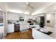 Bright kitchen featuring white cabinets, stainless steel appliances, and wood-look floors at 3606 Garden Lakes Clenet, Bradenton, FL 34203