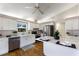 Modern kitchen features white cabinets, stainless steel appliances, hardwood floors and a window view at 3606 Garden Lakes Clenet, Bradenton, FL 34203