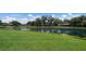 Enjoy the beauty of this lawn and pond view in the neighborhood at 3606 Garden Lakes Clenet, Bradenton, FL 34203