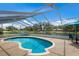 Inviting screened-in pool with views of the tranquil backyard pond and lush surroundings at 3606 Garden Lakes Clenet, Bradenton, FL 34203