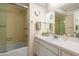 Bathroom featuring a glass shower door, a toilet, and a large mirror above the sink at 3626 Medford Ln # 1537, Sarasota, FL 34232