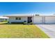 Charming single-story home with a well-manicured lawn and attached single-car garage at 3626 Medford Ln # 1537, Sarasota, FL 34232