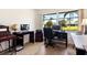 Bright home office with natural light, ample workspace, and verdant outdoor views at 3626 Medford Ln # 1537, Sarasota, FL 34232