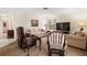 Living room with carpet, natural light, and neutral furnishings with a large television screen at 3626 Medford Ln # 1537, Sarasota, FL 34232