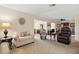 Inviting living room featuring neutral tones, comfortable seating, and seamless flow into other living spaces at 3626 Medford Ln # 1537, Sarasota, FL 34232