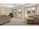Bright living room area featuring large windows and comfortable furnishings at 3626 Medford Ln # 1537, Sarasota, FL 34232