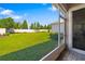 Spacious backyard with privacy fence, manicured lawn, and lush landscaping at 3644 Pitch Ln, Sarasota, FL 34232