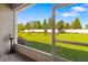 Landscaped backyard viewed from a screened porch with plenty of room to entertain at 3644 Pitch Ln, Sarasota, FL 34232