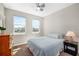 Cozy bedroom with natural light, a ceiling fan, and neutral decor creating a peaceful atmosphere at 3644 Pitch Ln, Sarasota, FL 34232