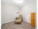 Relaxing room with accent chair and a small wooden dresser at 3644 Pitch Ln, Sarasota, FL 34232