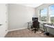 Cozy carpeted bedroom with natural light, perfect for a home office setup at 3644 Pitch Ln, Sarasota, FL 34232
