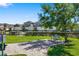 Charming community area with lush green grass, benches, and well-maintained landscaping for relaxing outdoors at 3644 Pitch Ln, Sarasota, FL 34232